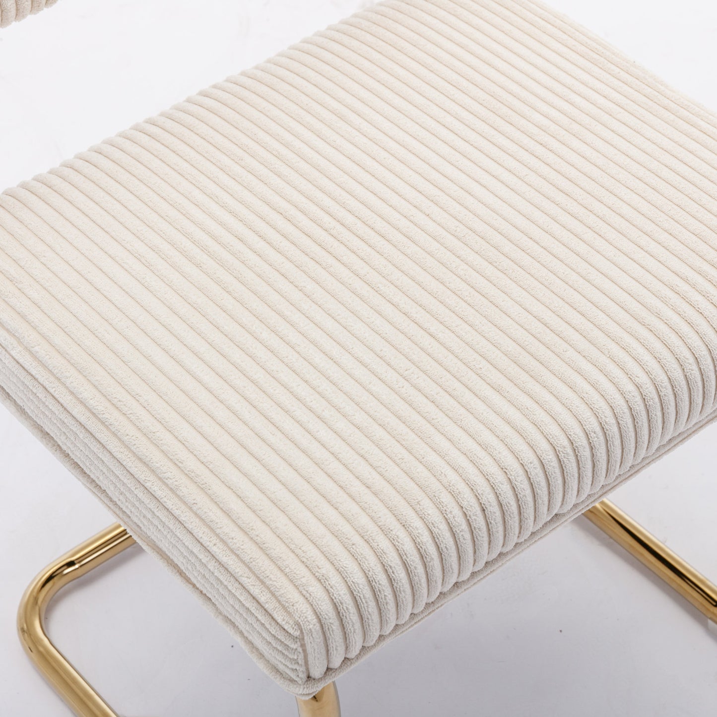 Cream corduroy upholstered bench with gold metal frame