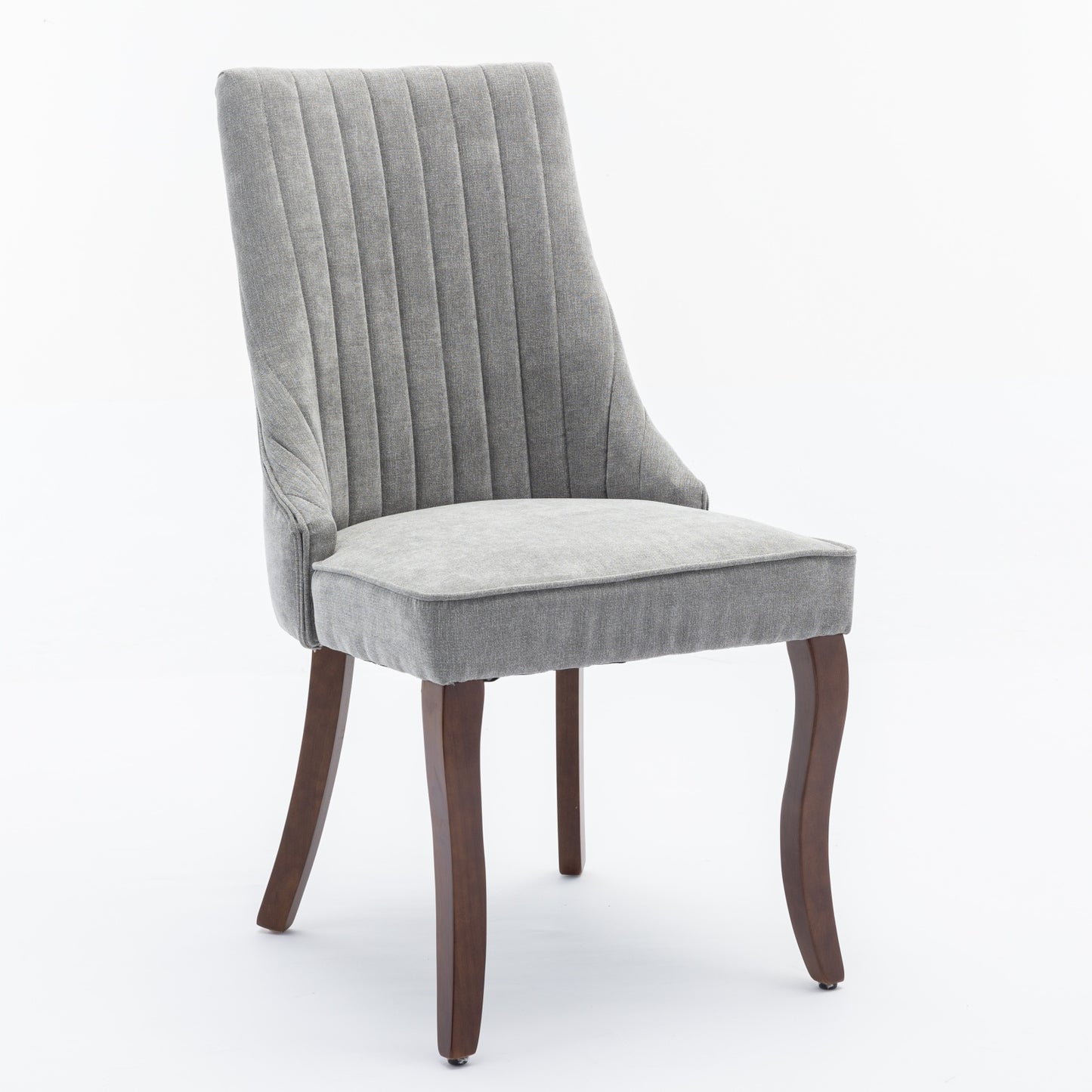 Grey upholstered dining chair with vertical channel tufting and dark wood legs