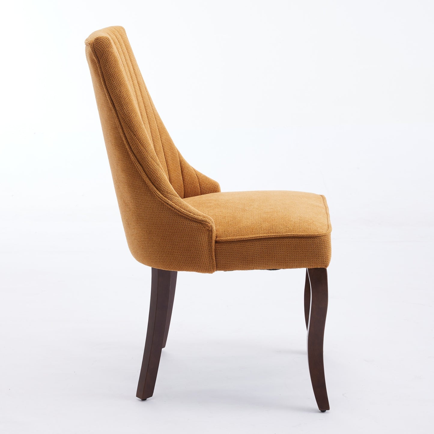 Mustard yellow upholstered dining chair with channel tufted back and dark wood legs