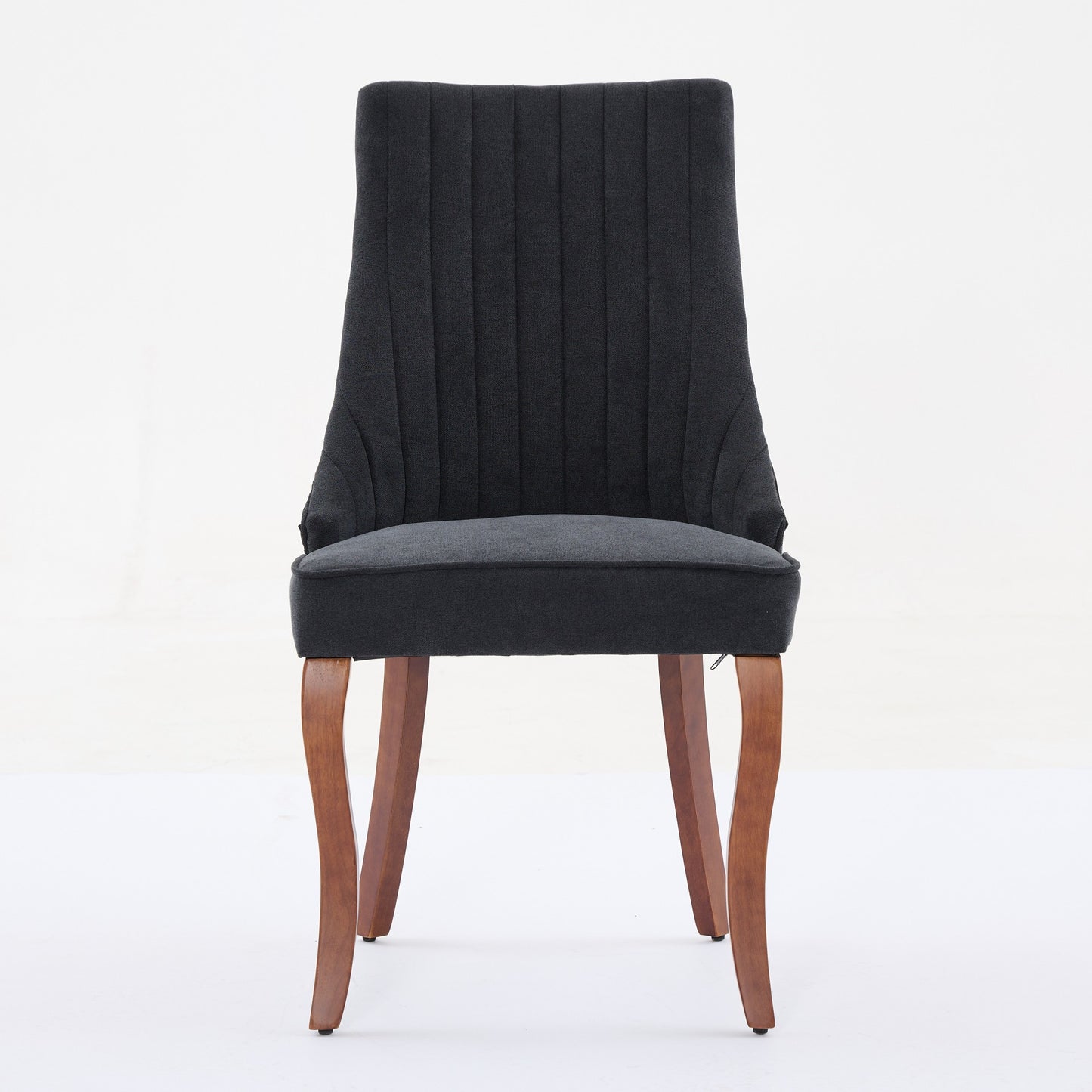 Dark gray upholstered dining chair with channeled back and wooden legs