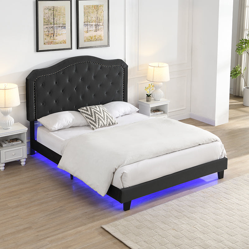 Black velvet tufted platform bed with blue LED underglow
