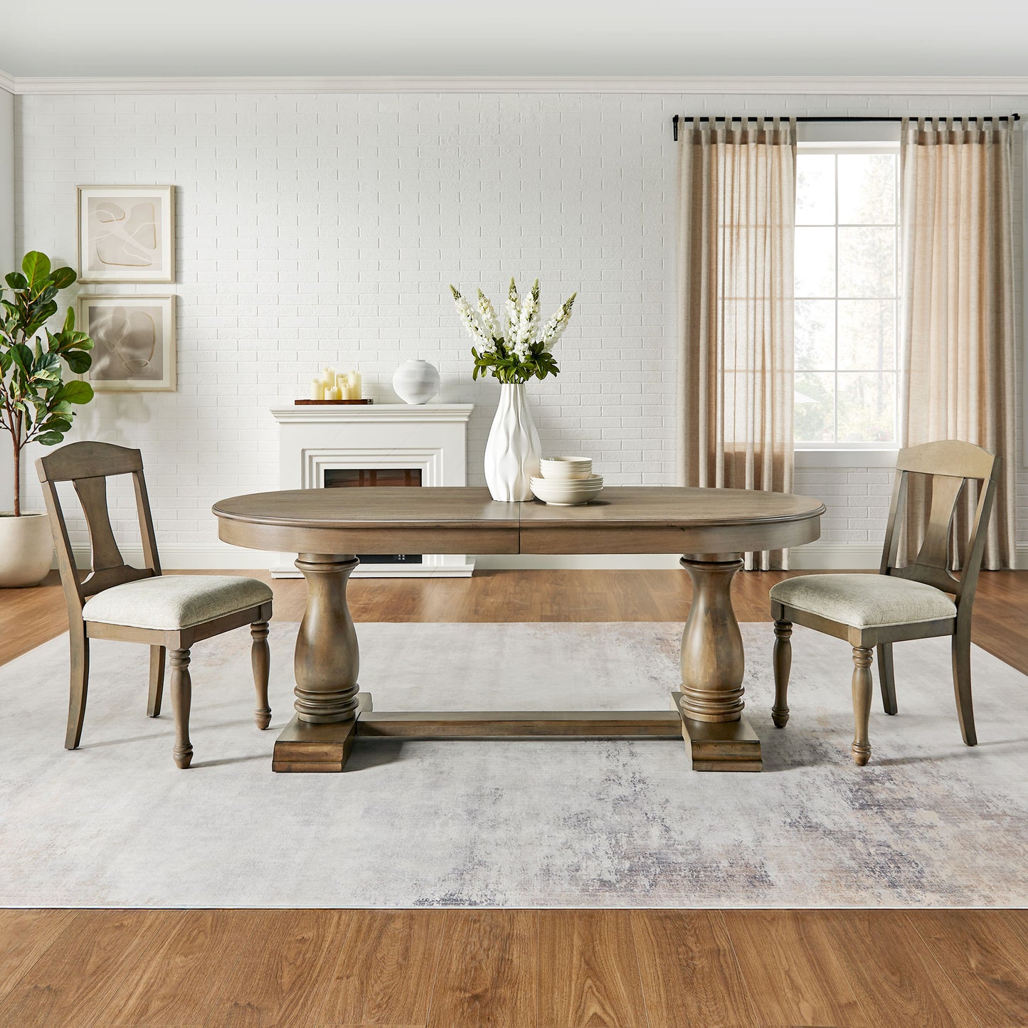 Rustic oak extendable dining table with pedestal base and upholstered chairs