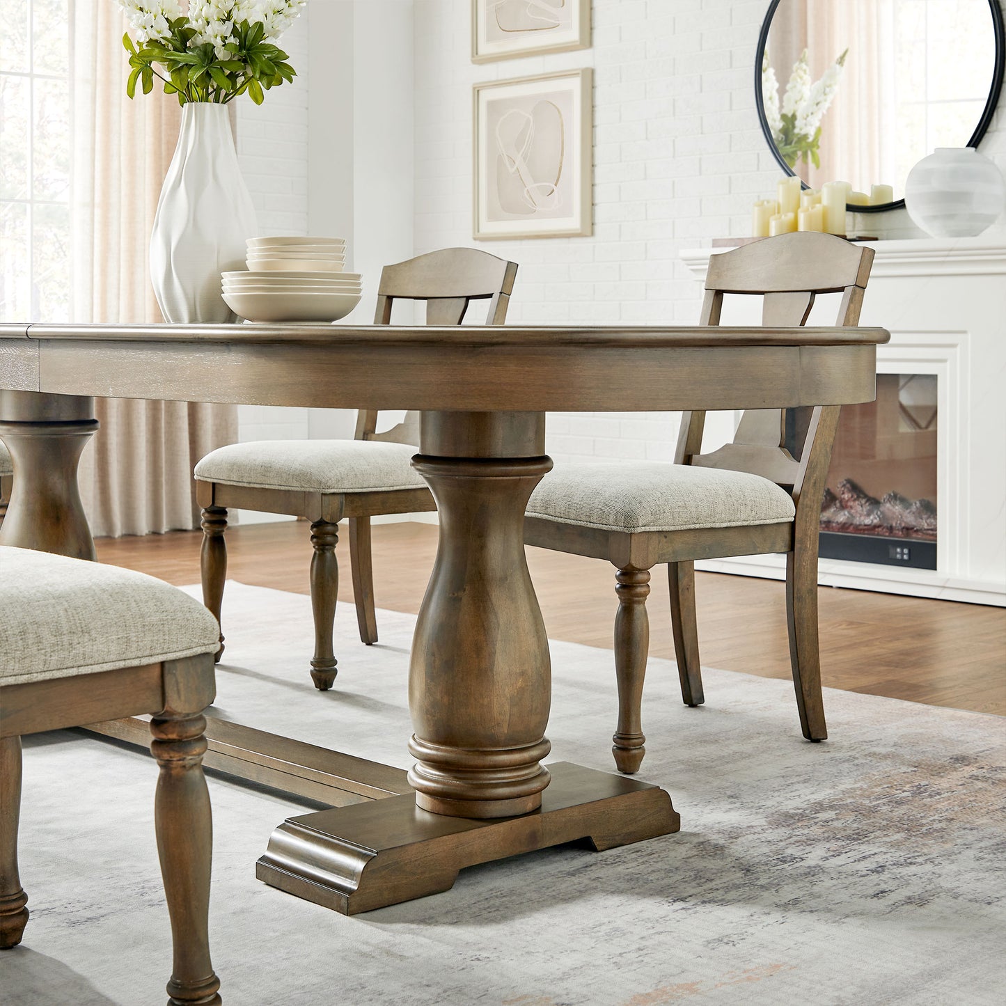Rustic wooden dining table with upholstered chairs