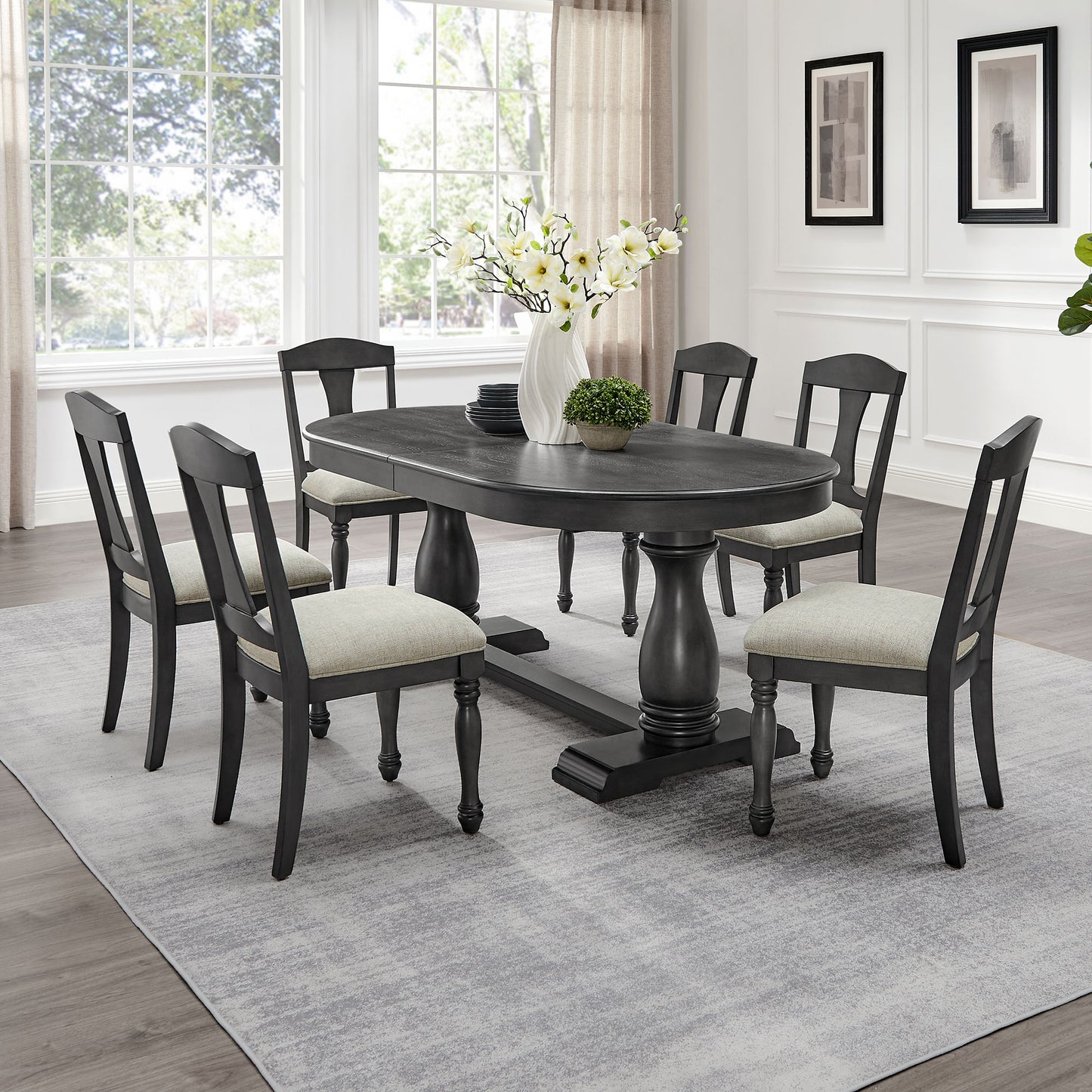 Dark wood oval dining table with six chairs