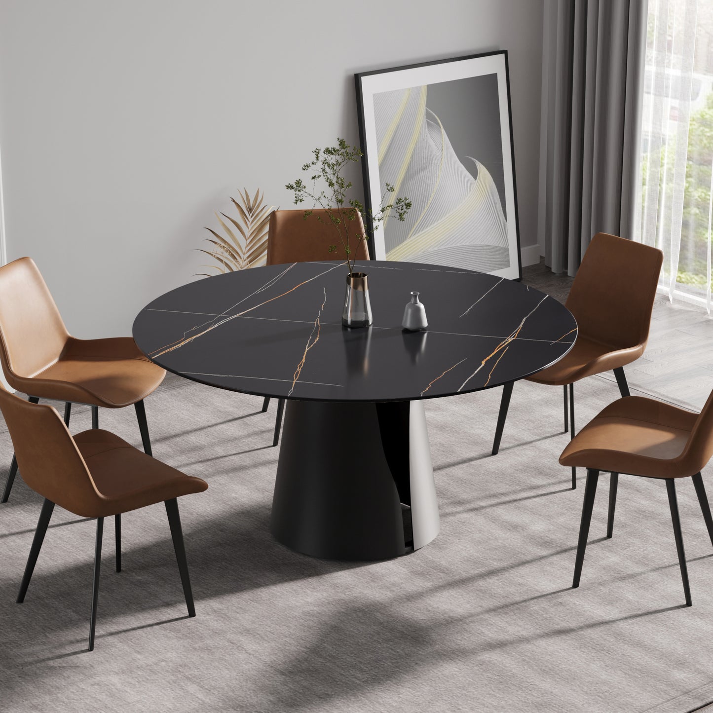 Black marble round dining table with gold veining and four brown leather chairs