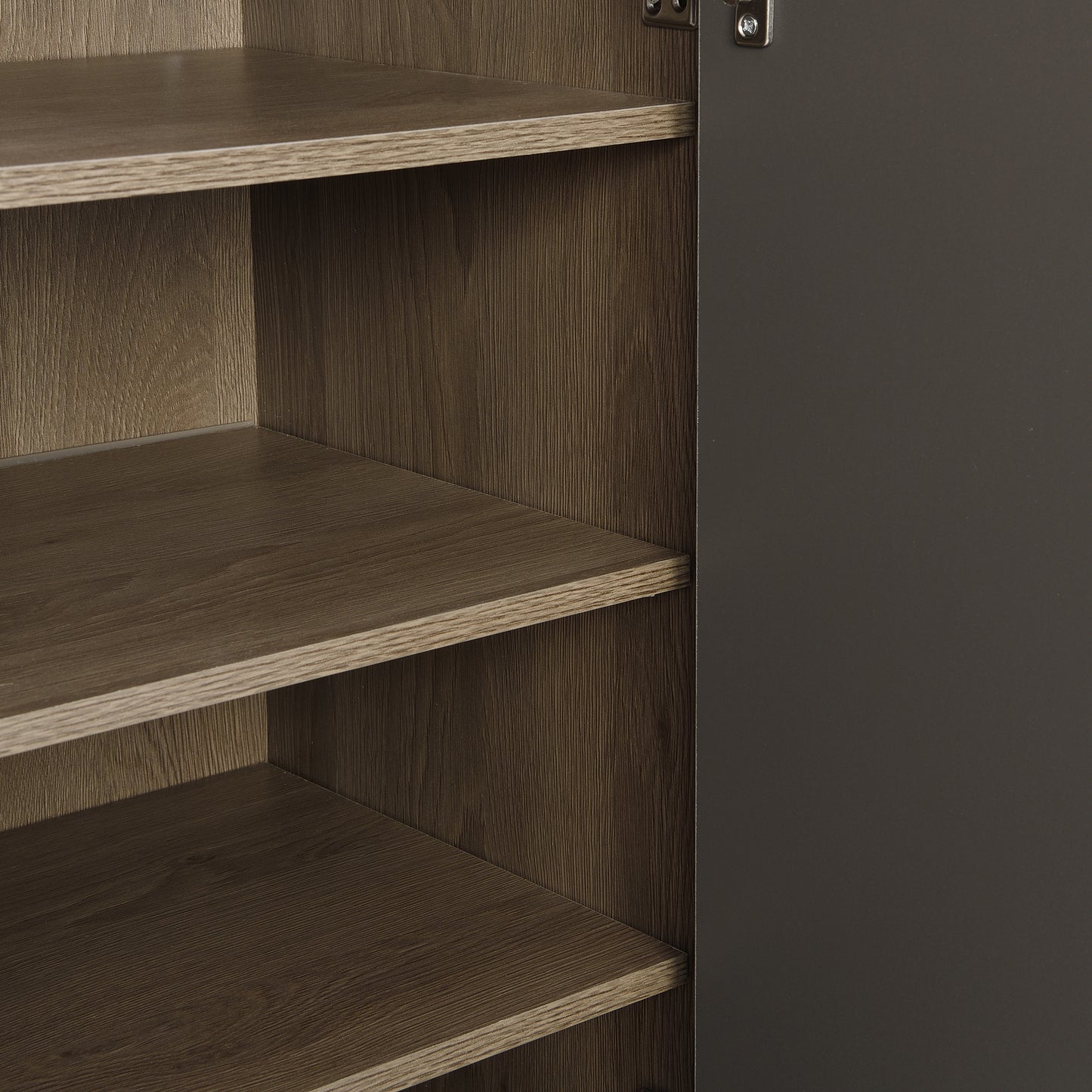 Close up of open dark brown wood grain cabinet interior with shelves