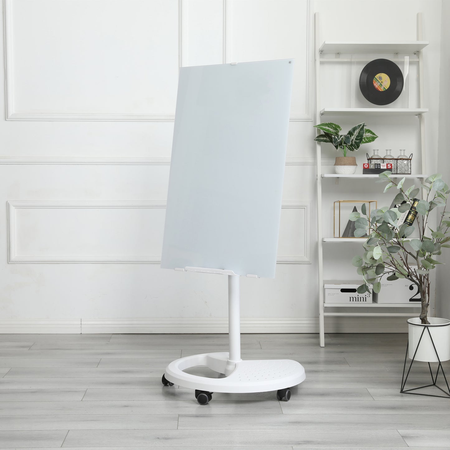 Sleek glass whiteboard on a rolling stand for office collaboration