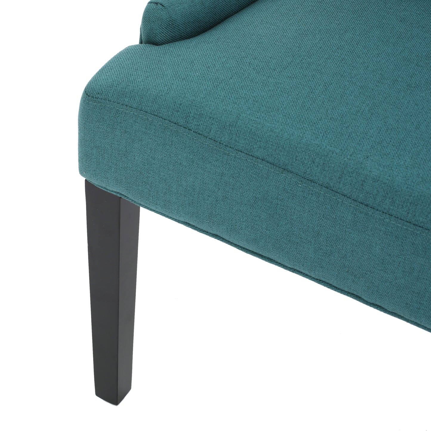 Teal upholstered armchair side view with dark wood leg