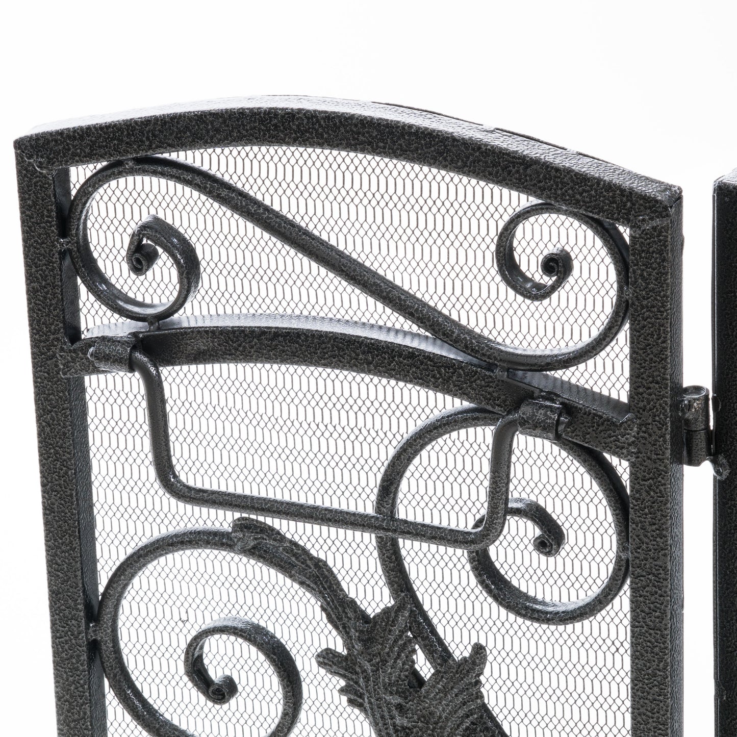 Black metal ornate fireplace screen with scrolling details and fine mesh