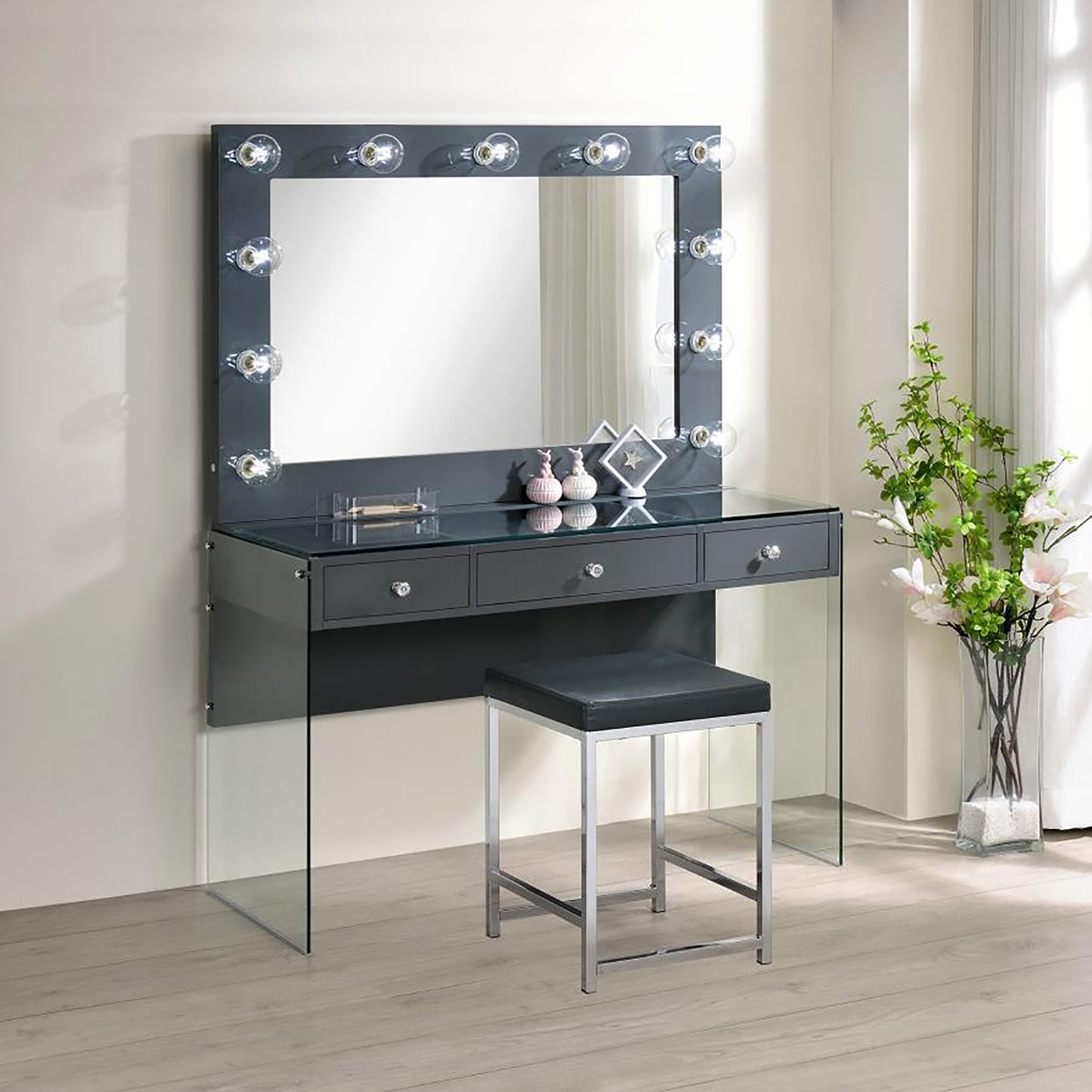 Grey vanity with Hollywood lights and glass top