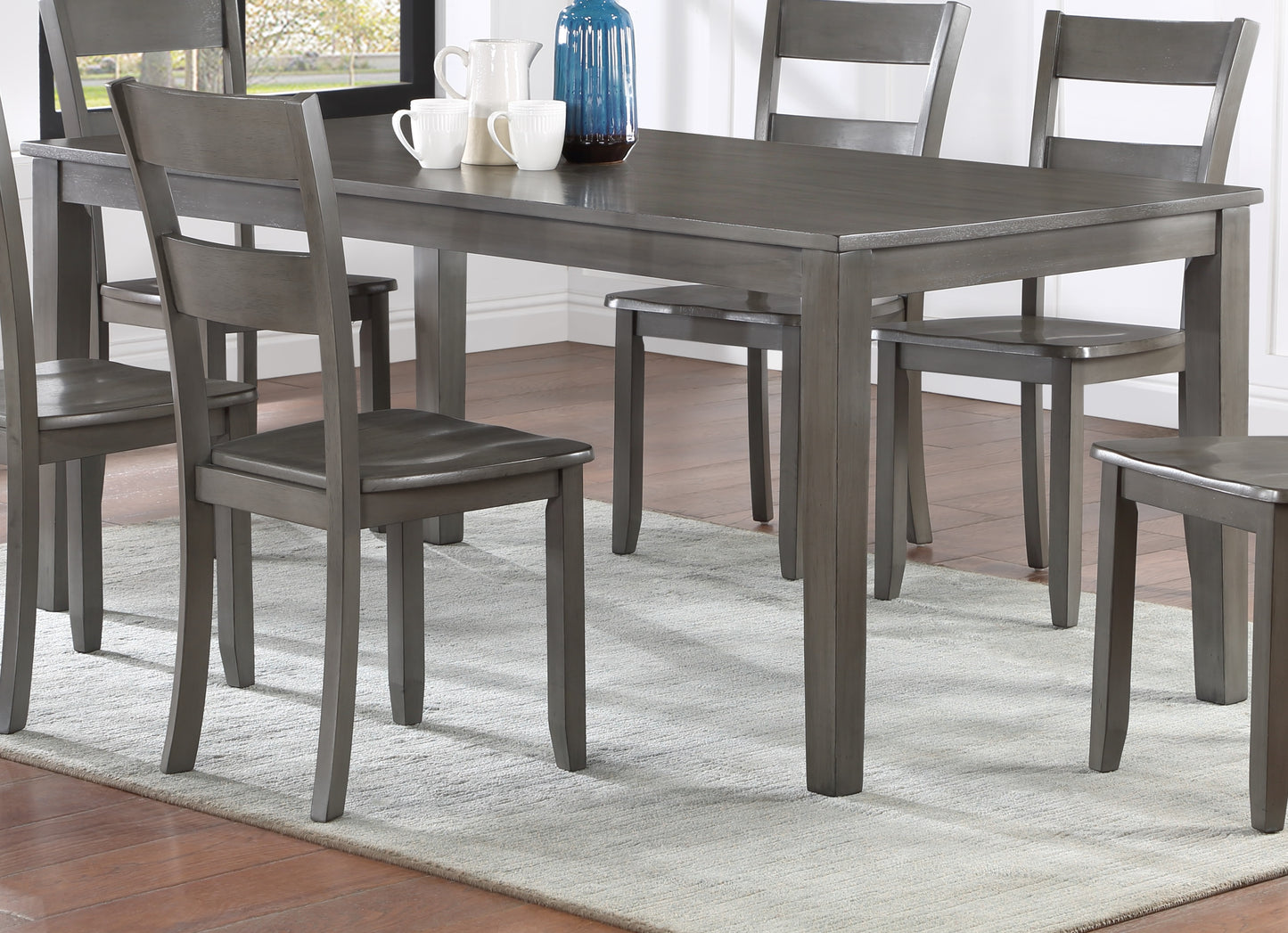 Gray wooden dining table with matching chairs