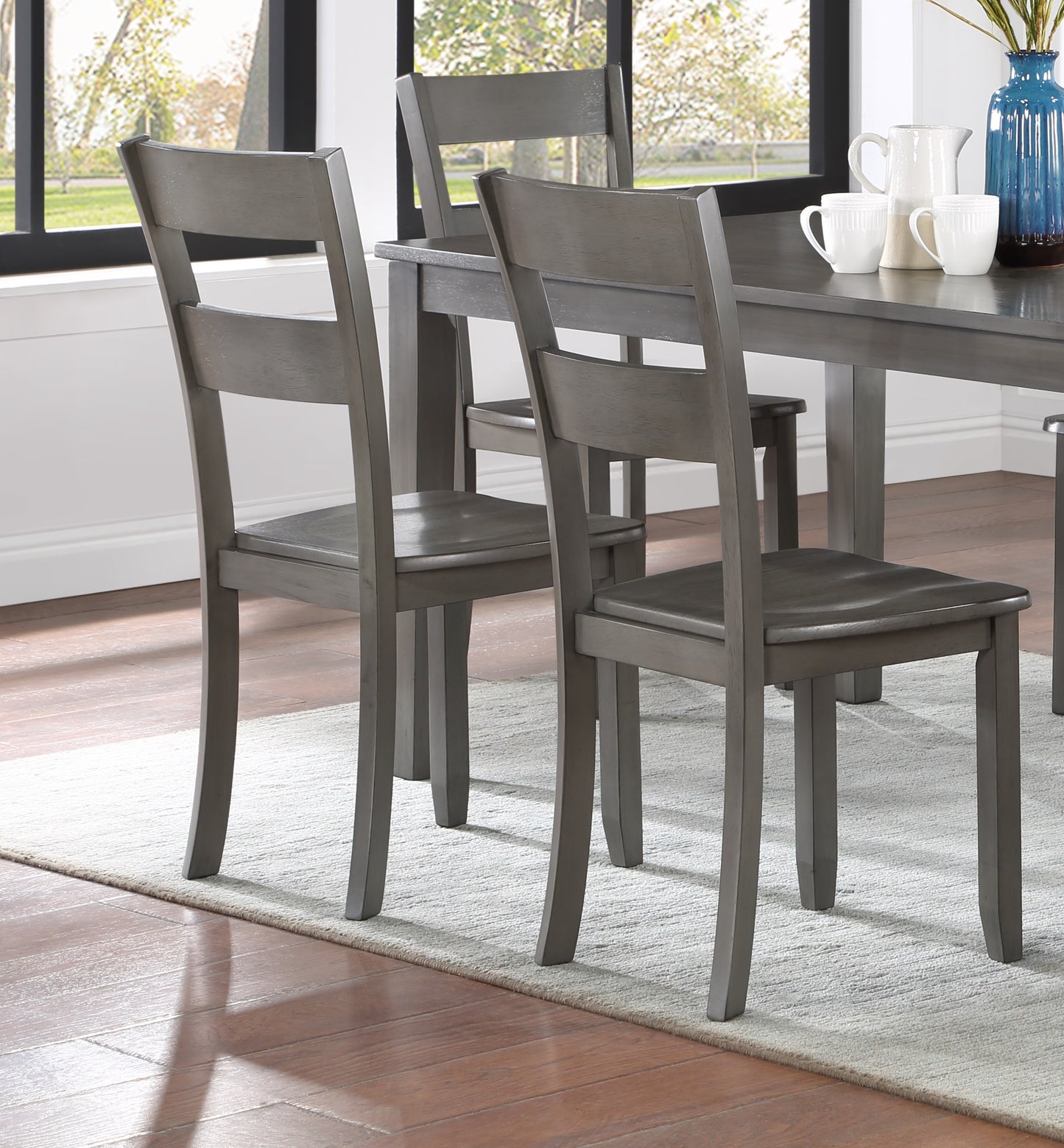 Gray wooden dining chair with a slatted back design