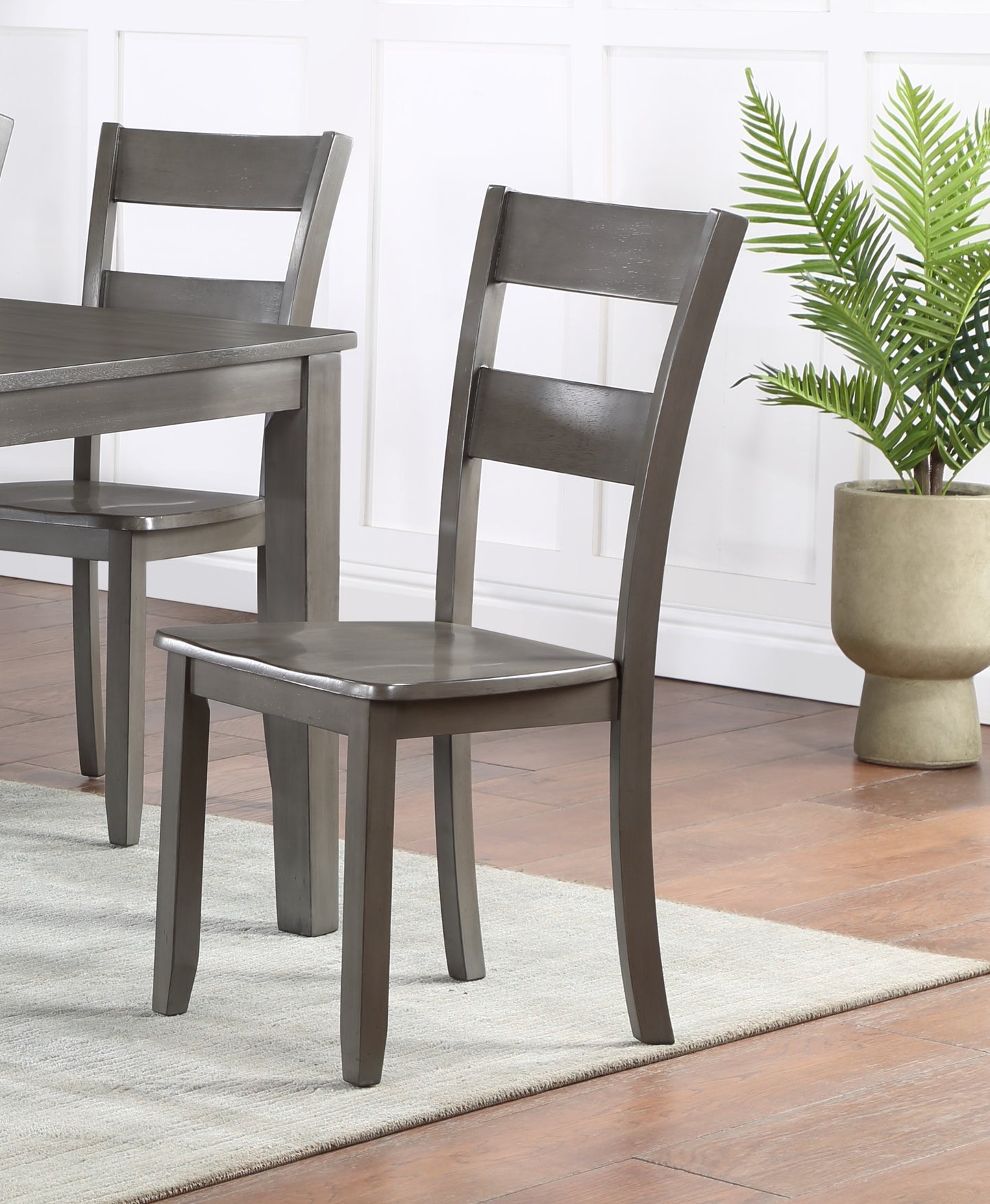 Gray wooden dining chair with ladder back detail