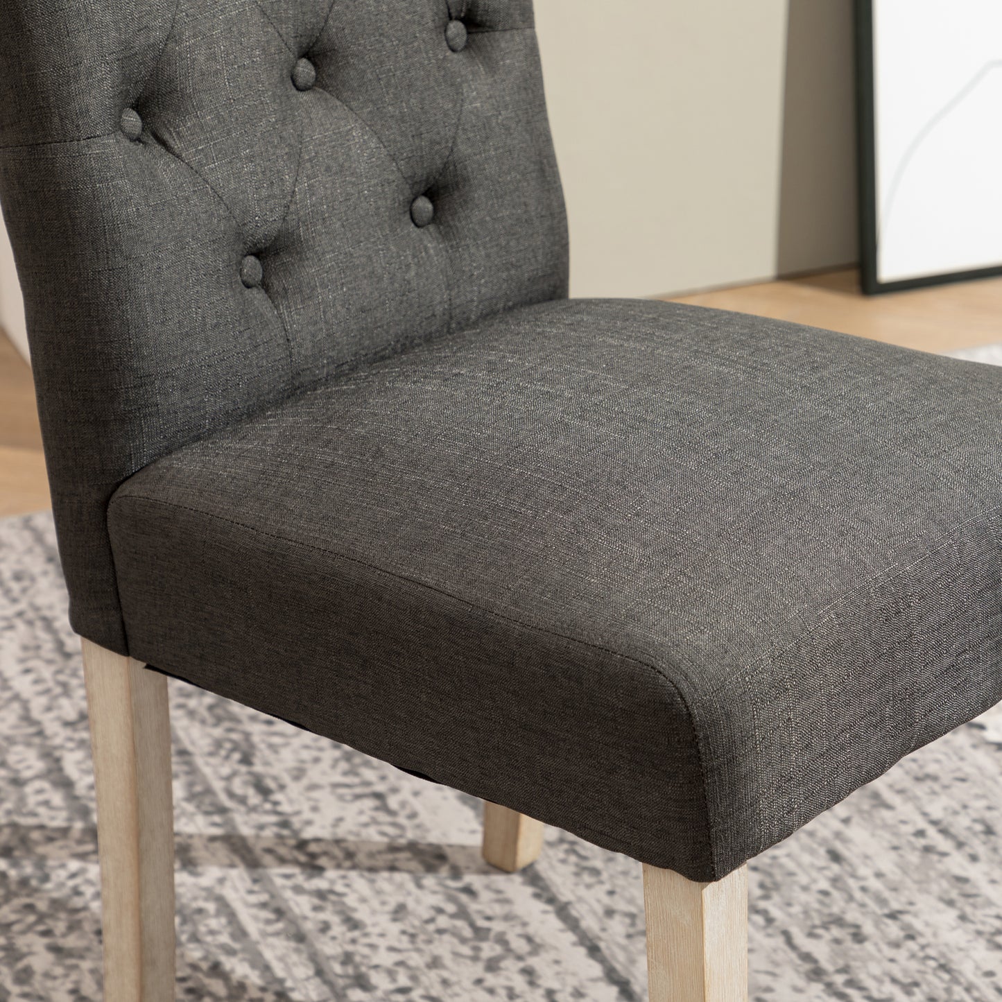 Dark grey tufted dining chair