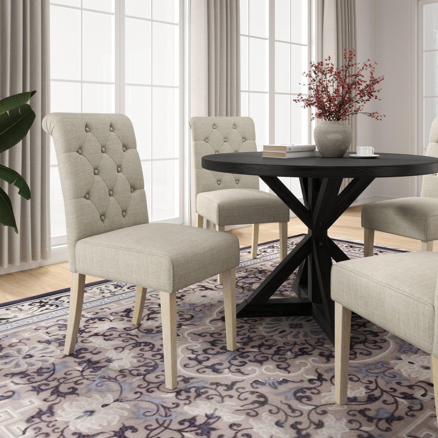 Tufted linen dining chair with light wood legs and scrollpatterned rug