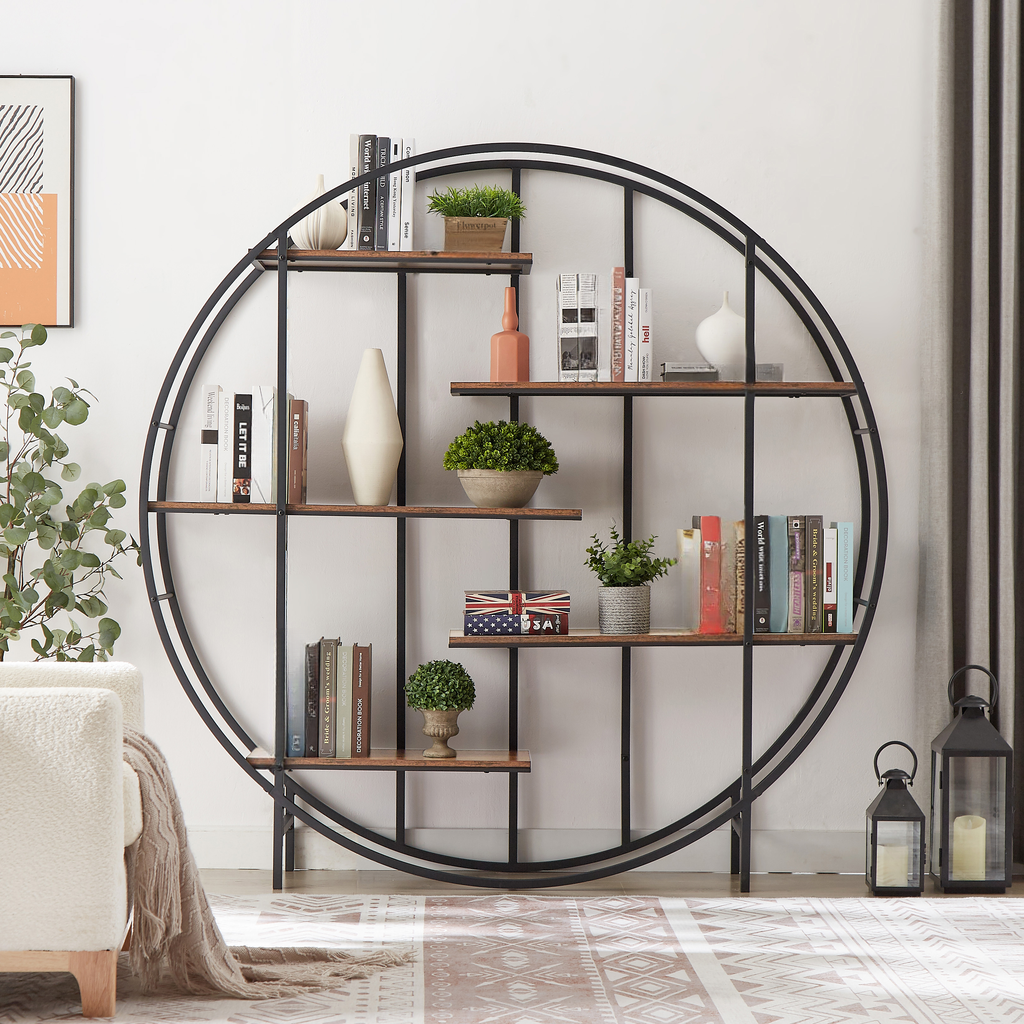 Round metal bookshelf with wooden shelves displaying books and decor