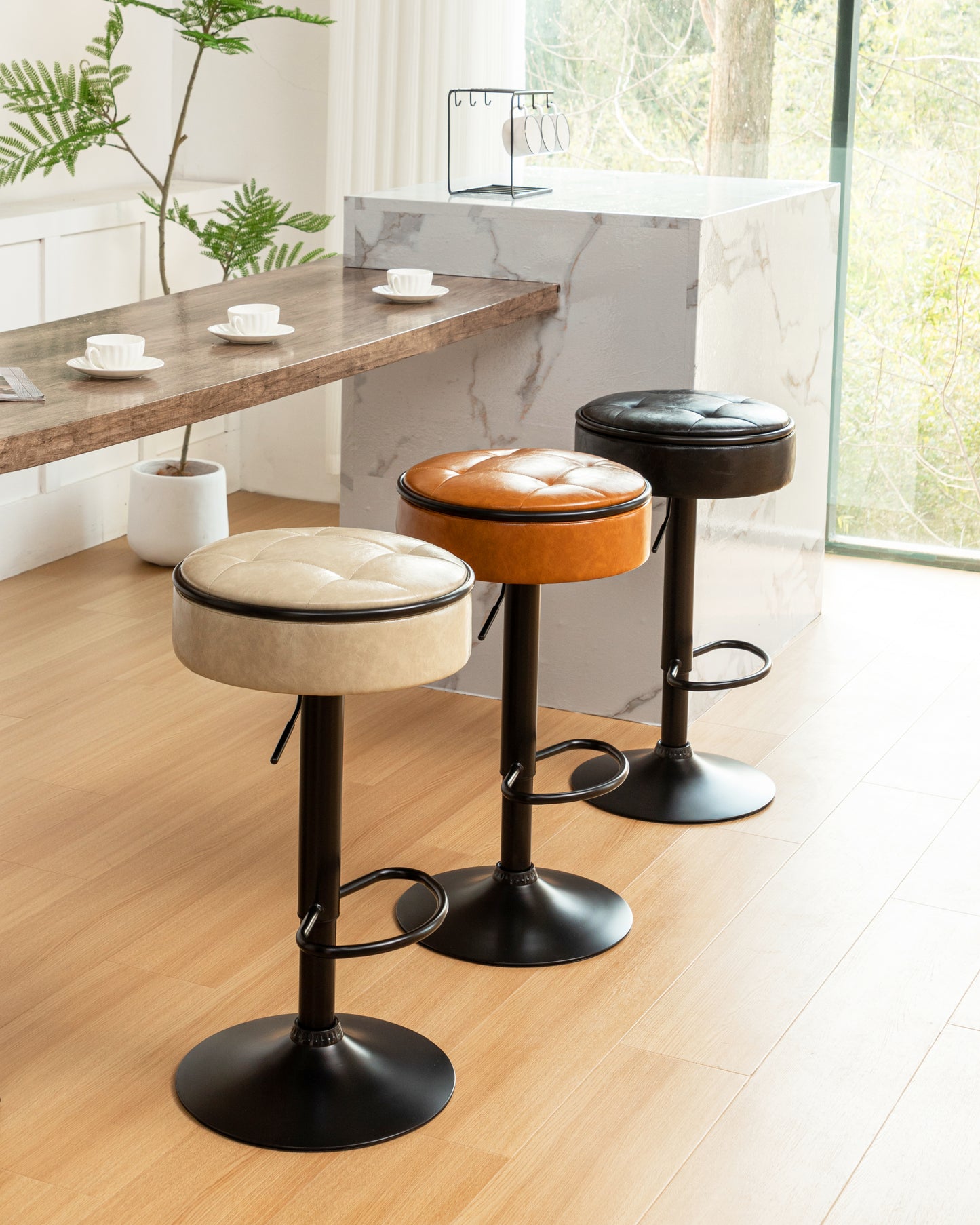 Adjustable height bar stool with beige tufted leather seat