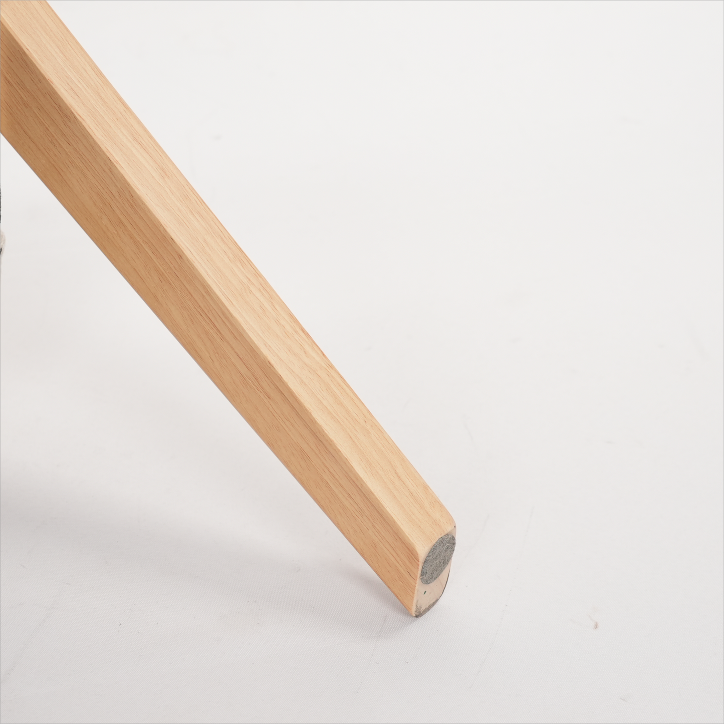 Natural oak wooden chair leg with felt floor protector
