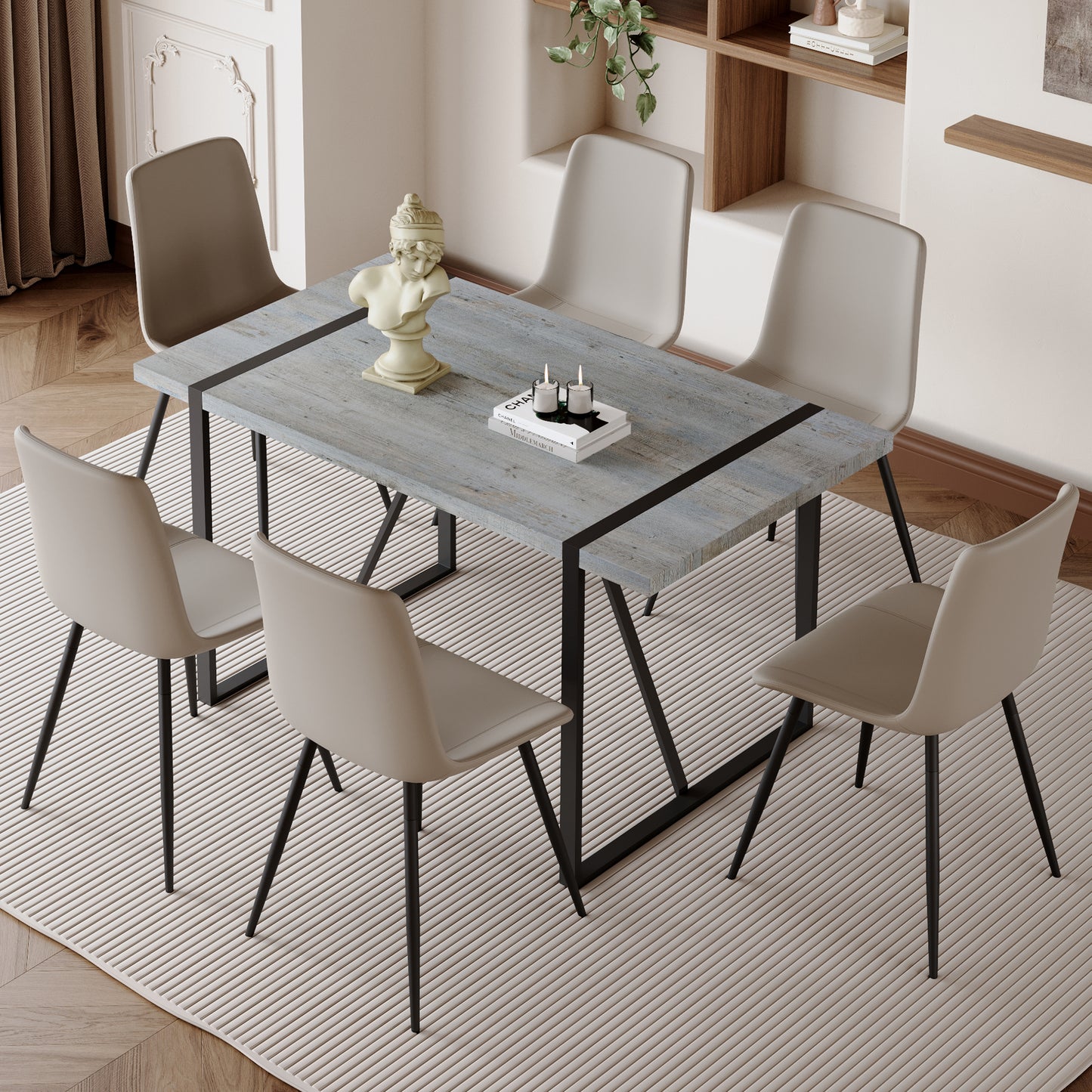 Rustic grey wood dining table with black metal legs and six beige chairs