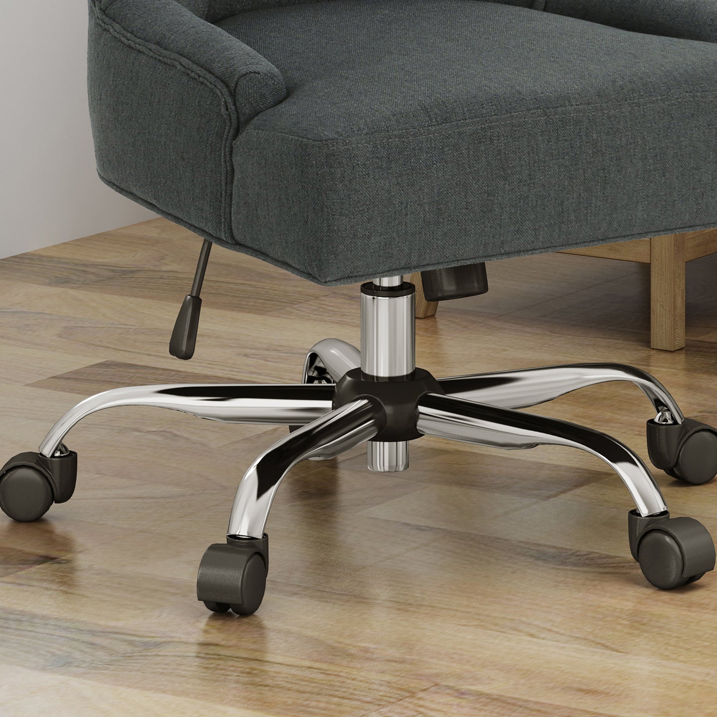 Dark grey fabric office chair with chrome fivestar base and wheels