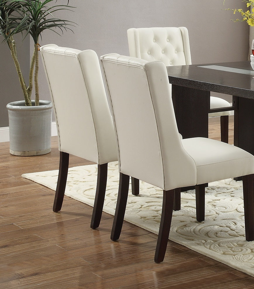 Tufted cream dining chairs with dark wood legs