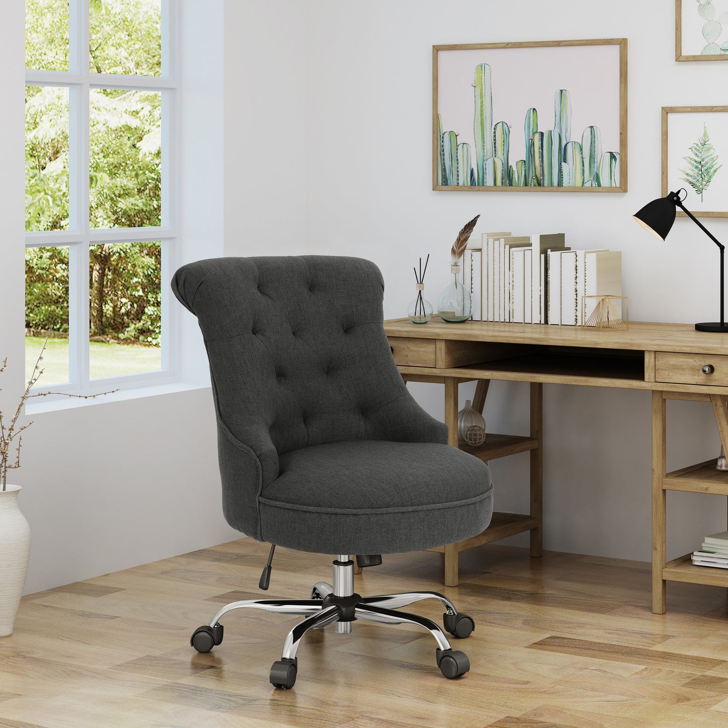 Tufted dark grey fabric office chair with chrome base and casters