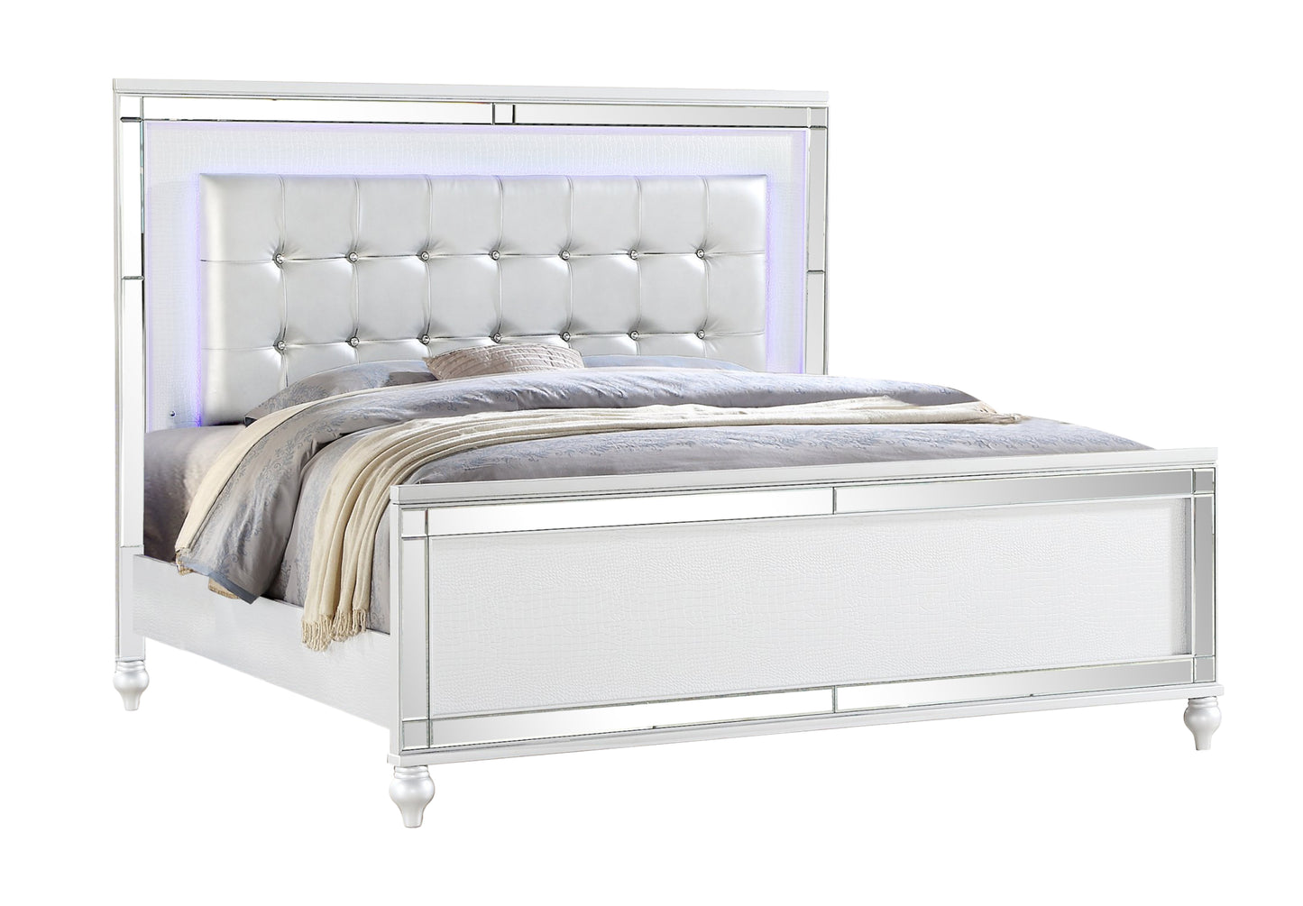 White upholstered bed with crystal tufting and mirrored trim