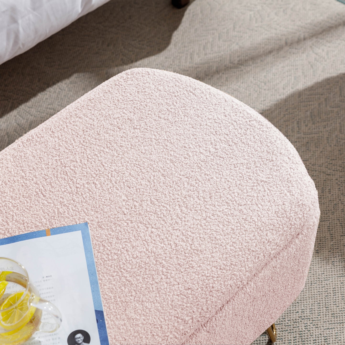 Pink boucle ottoman with golden legs