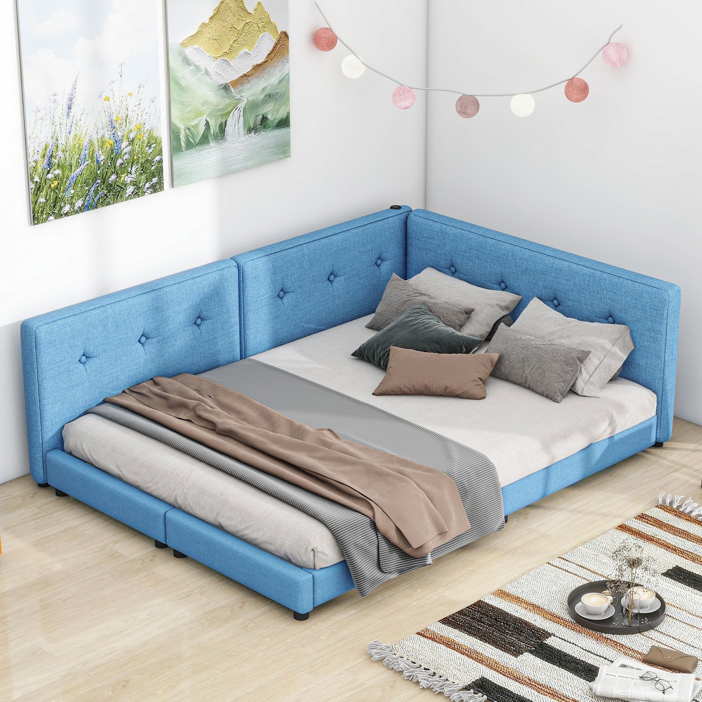 Blue upholstered Lshaped bed frame with button tufted headboards and bedding