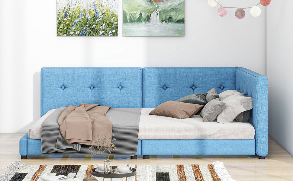 Blue upholstered twin daybed with tufted headboard and trundle