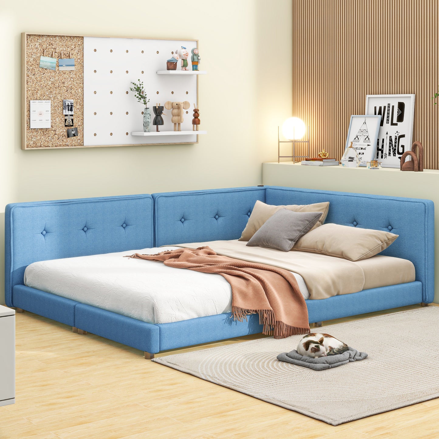 Blue upholstered corner bed with tufted headboard and tan throw