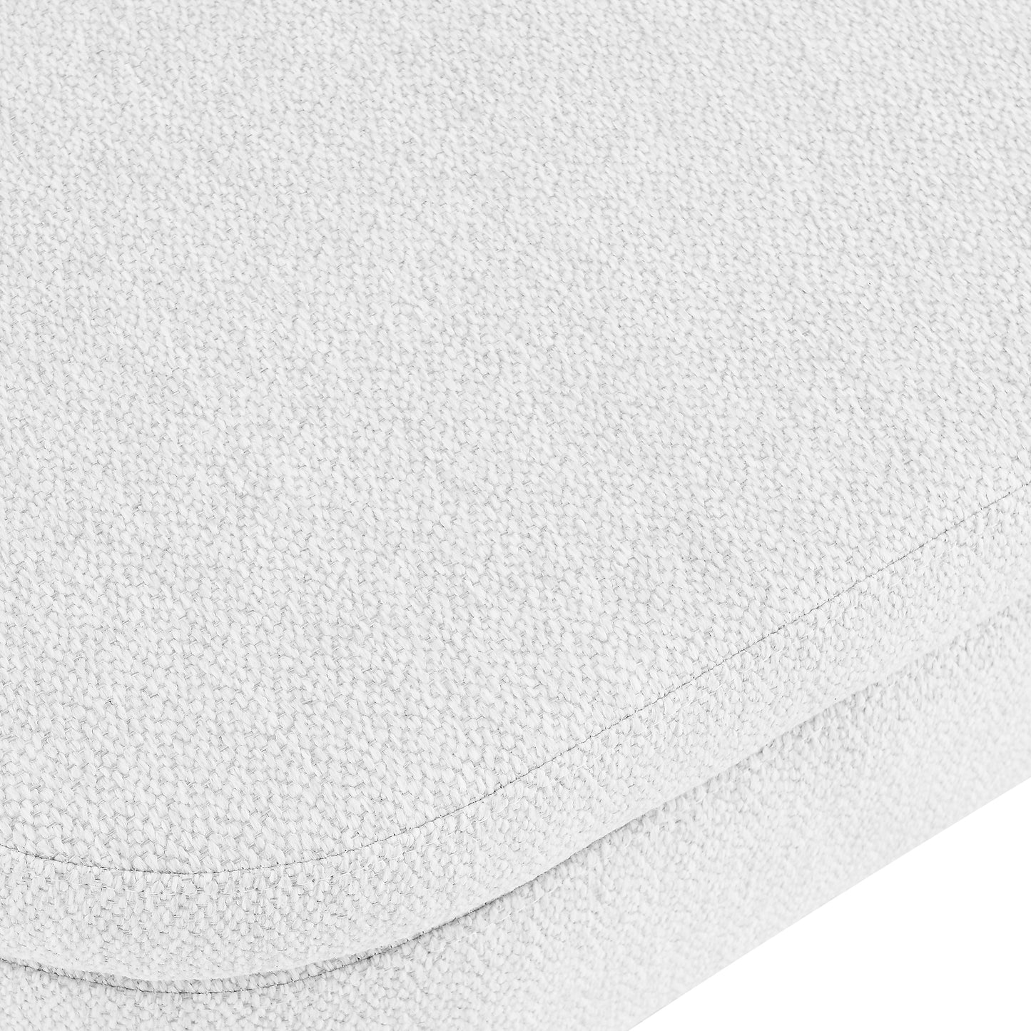 Closeup of textured white upholstery fabric on a sofa cushion