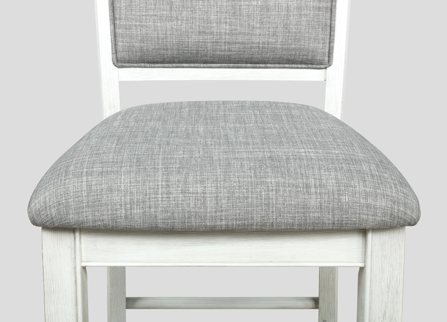 Upholstered grey fabric counter stool with distressed white wooden frame
