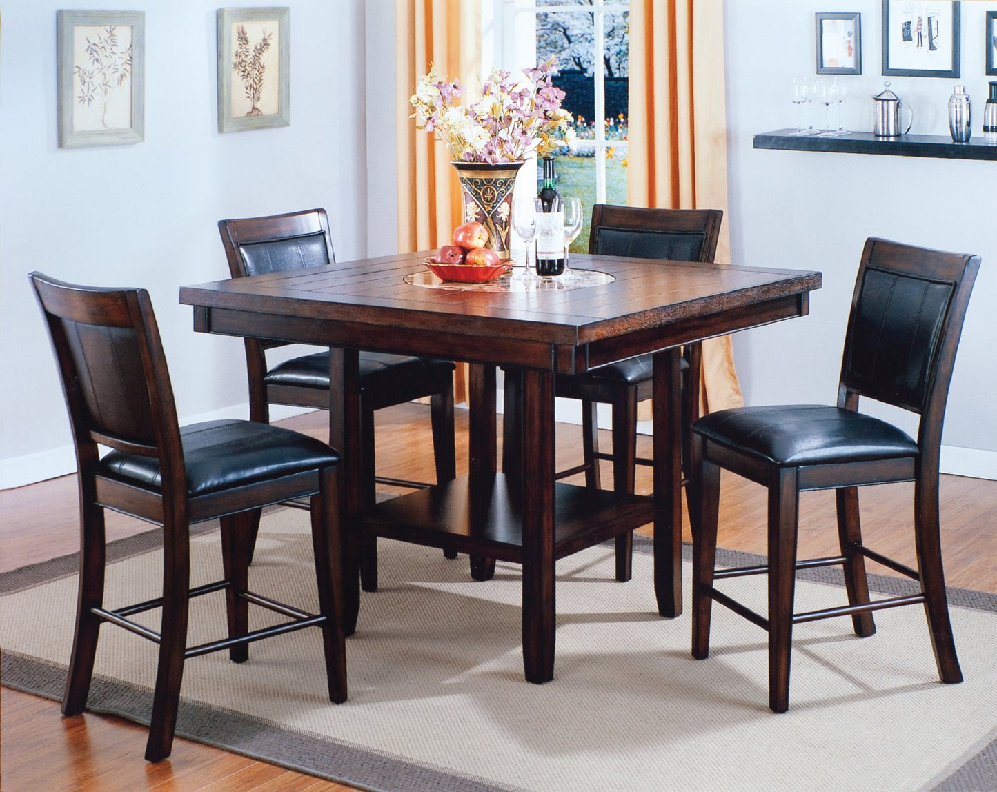 Dark wood counter height table with four black leatherette chairs