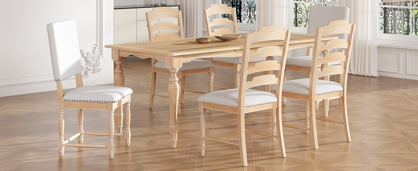 Light oak dining table with turned legs and six light upholstered chairs