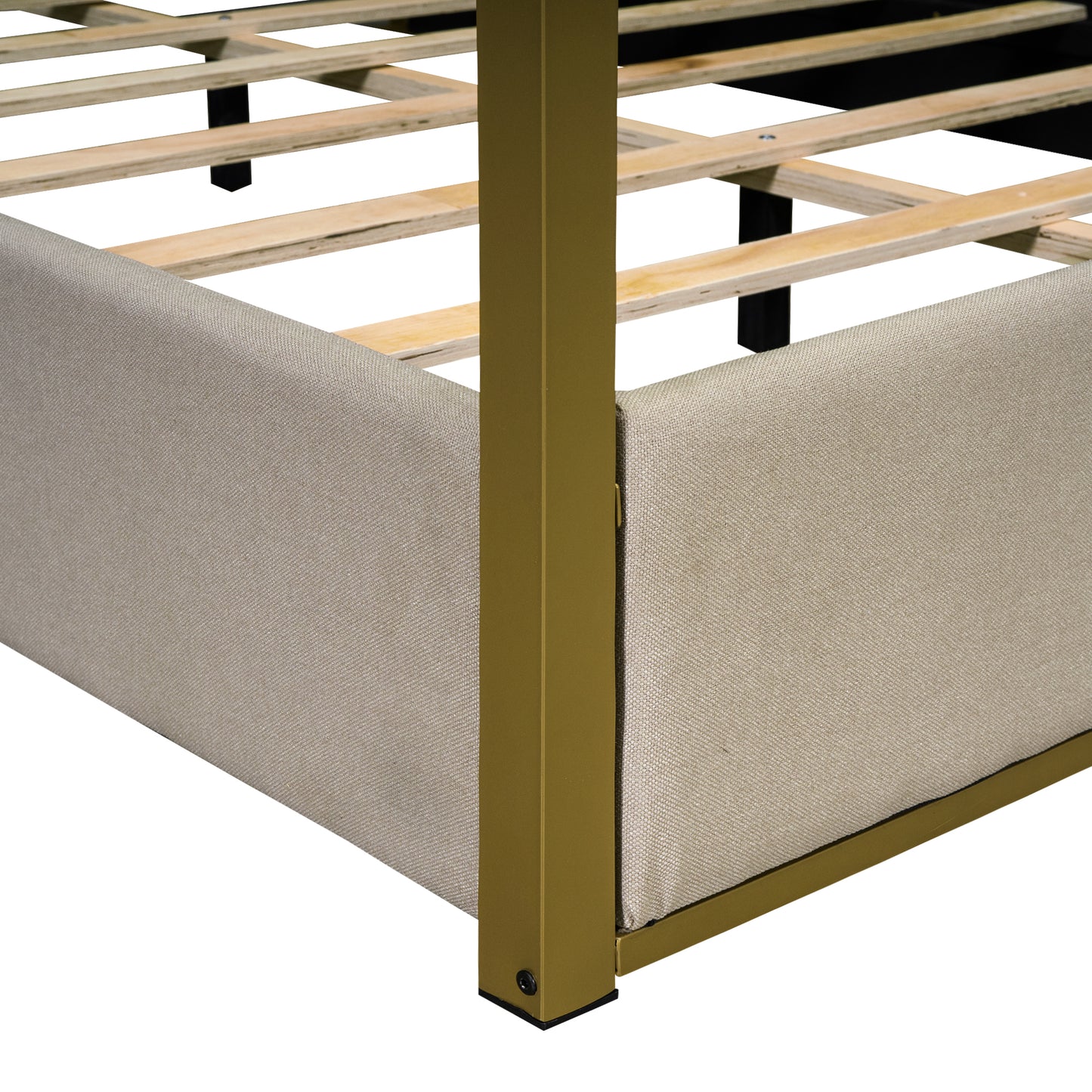 Beige upholstered bed frame with gold metal accents and wooden slats