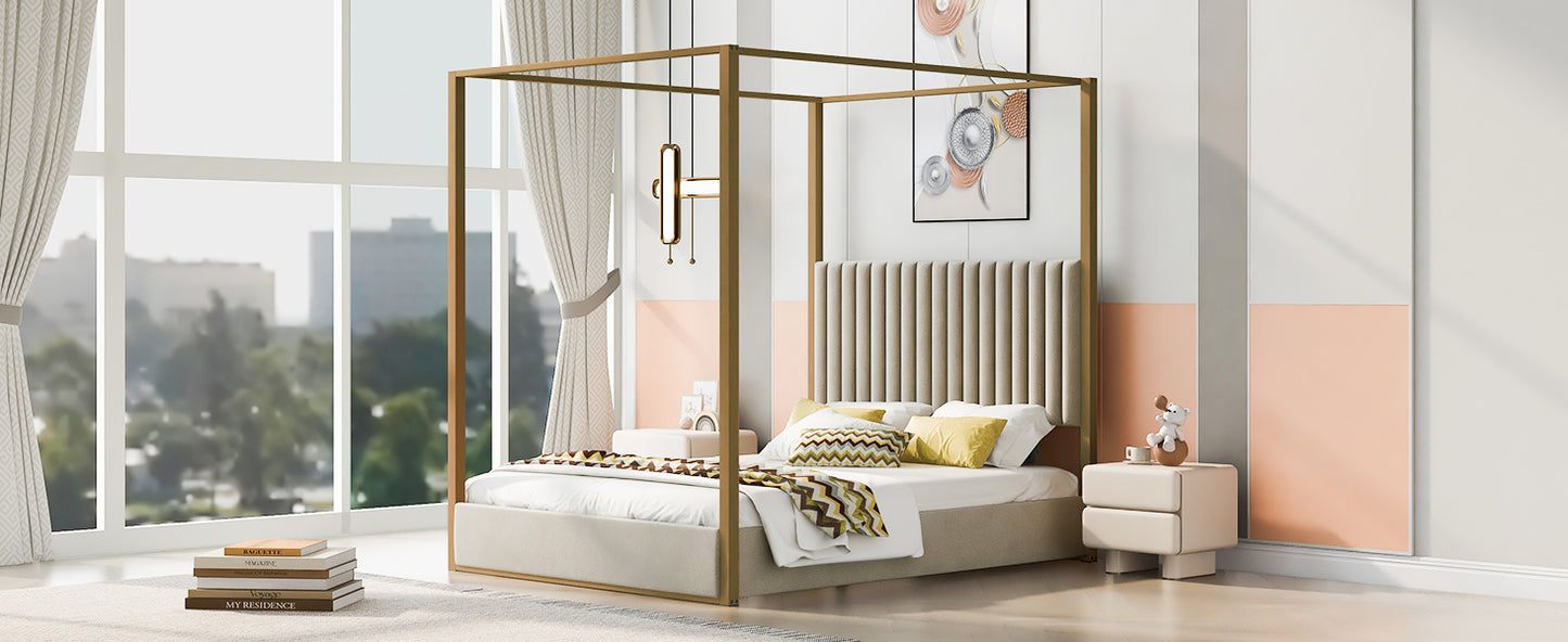 Gold canopy bed with upholstered beige headboard and patterned pillows
