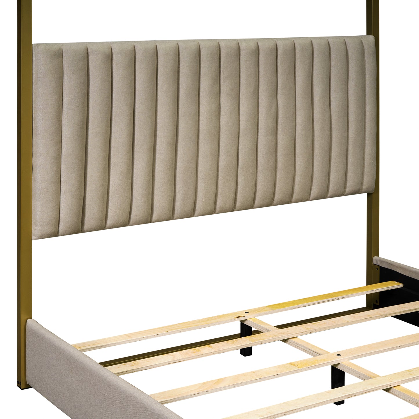 Upholstered beige headboard with vertical tufting on a gold metal frame for a modern platform bed
