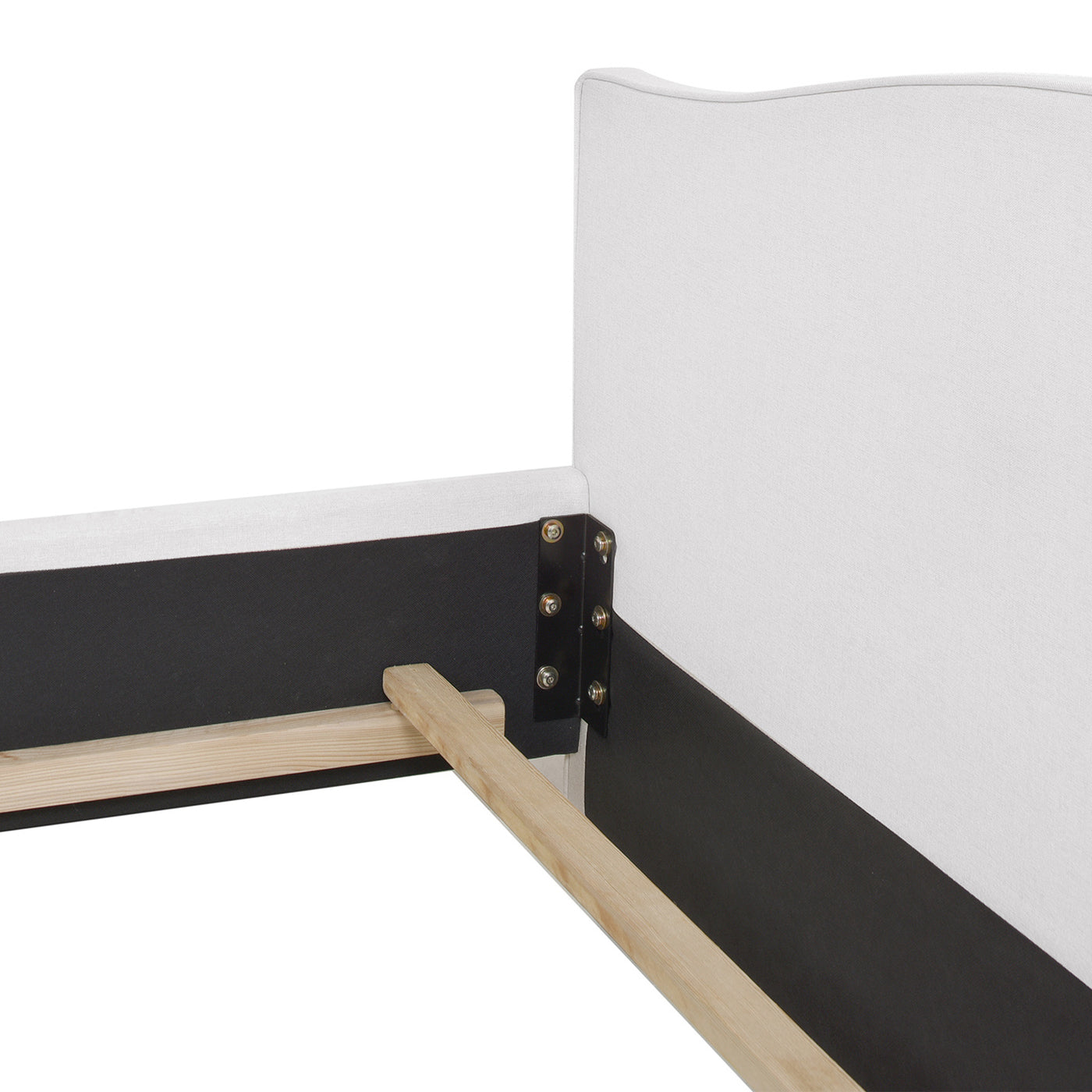 Closeup of white upholstered bed frame with wooden slats for mattress support