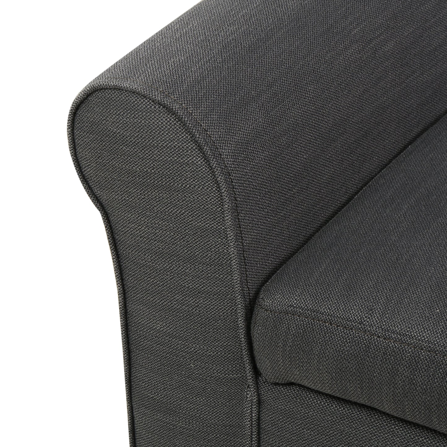 Closeup of a charcoal gray upholstered sofa armrest with textured fabric