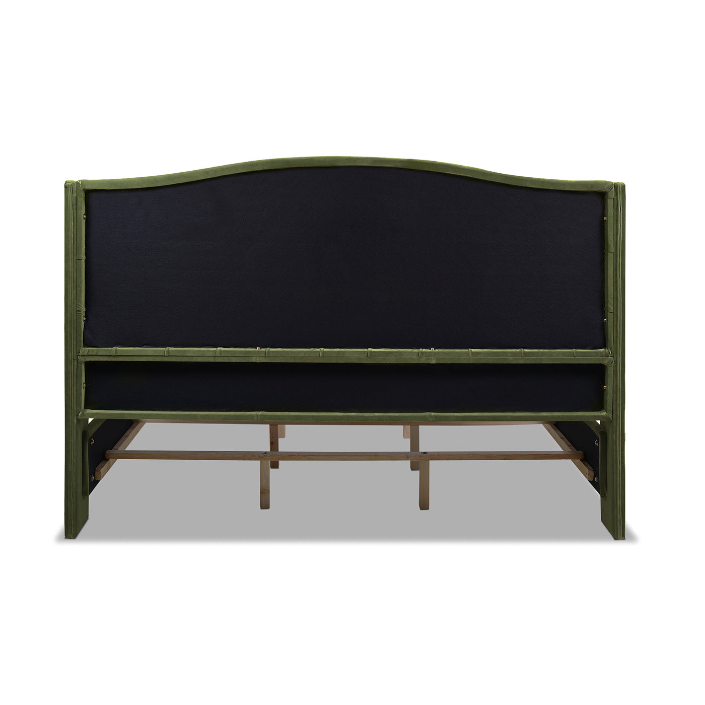 Green velvet upholstered headboard with curved top edge and dark fabric inset