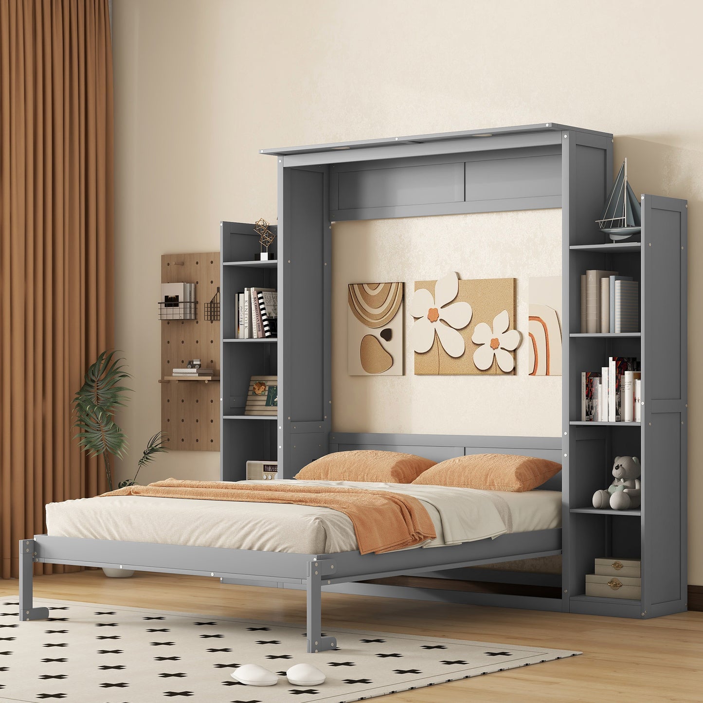 Gray Murphy bed with integrated bookshelves and orange accent pillows