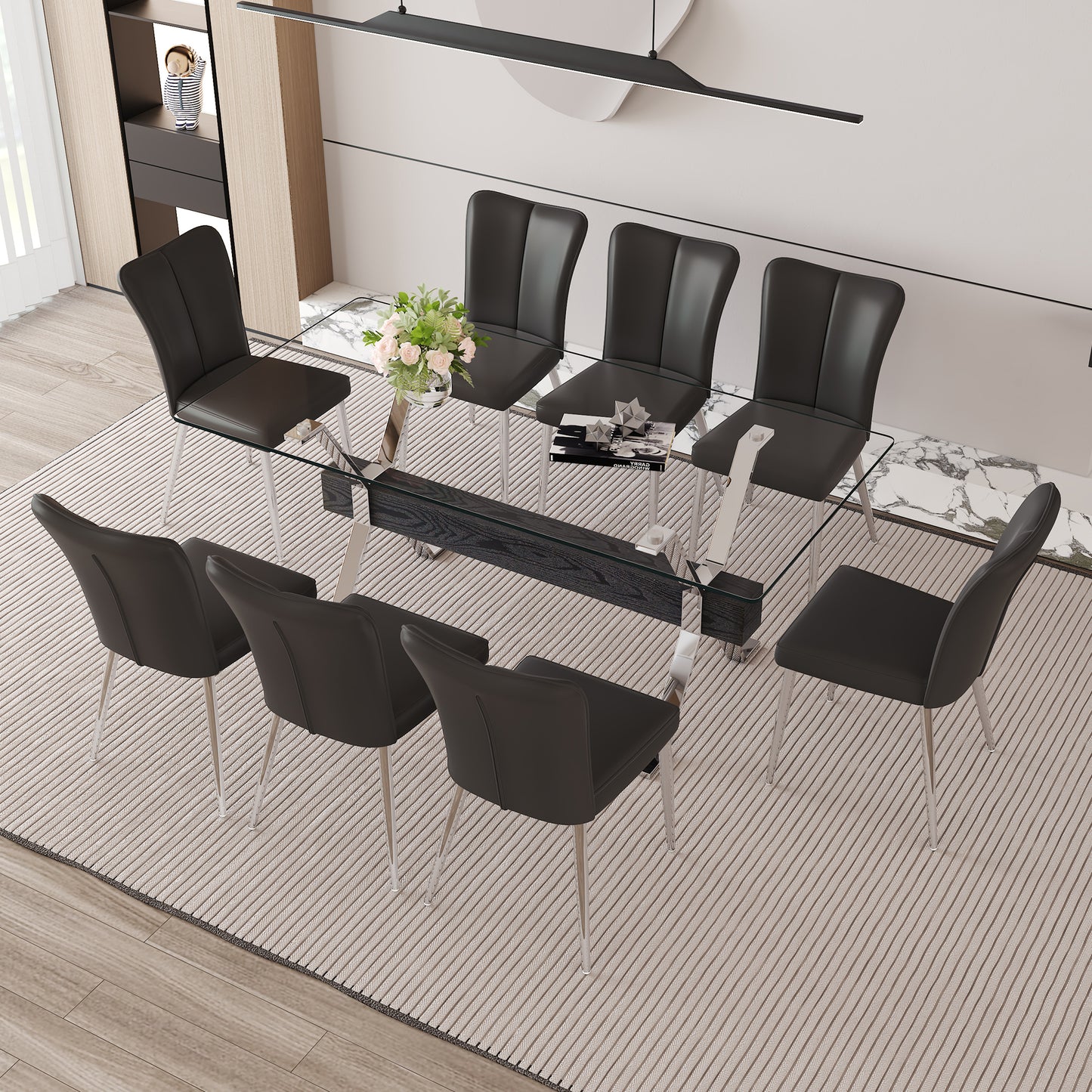 Modern glass dining table with eight black leather chairs and chrome legs