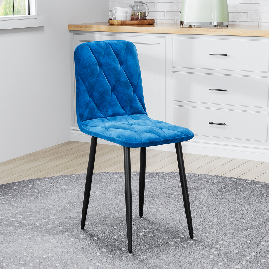 Blue velvet dining chair with diamond tufting and black metal legs