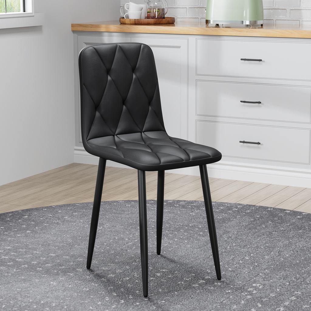 Black upholstered dining chair with diamond tufting and black metal legs