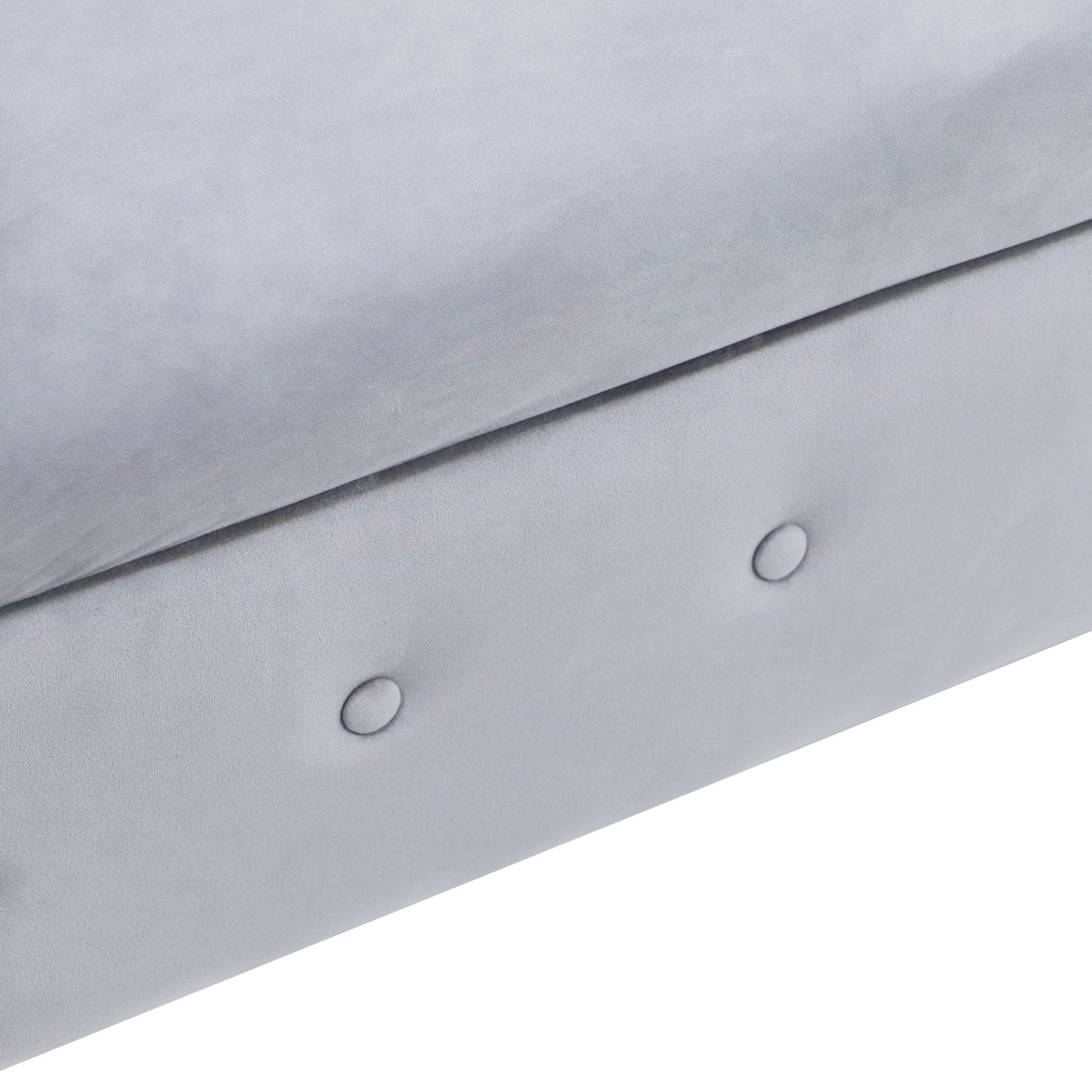 Light grey velvet sofa detail with subtle tufting