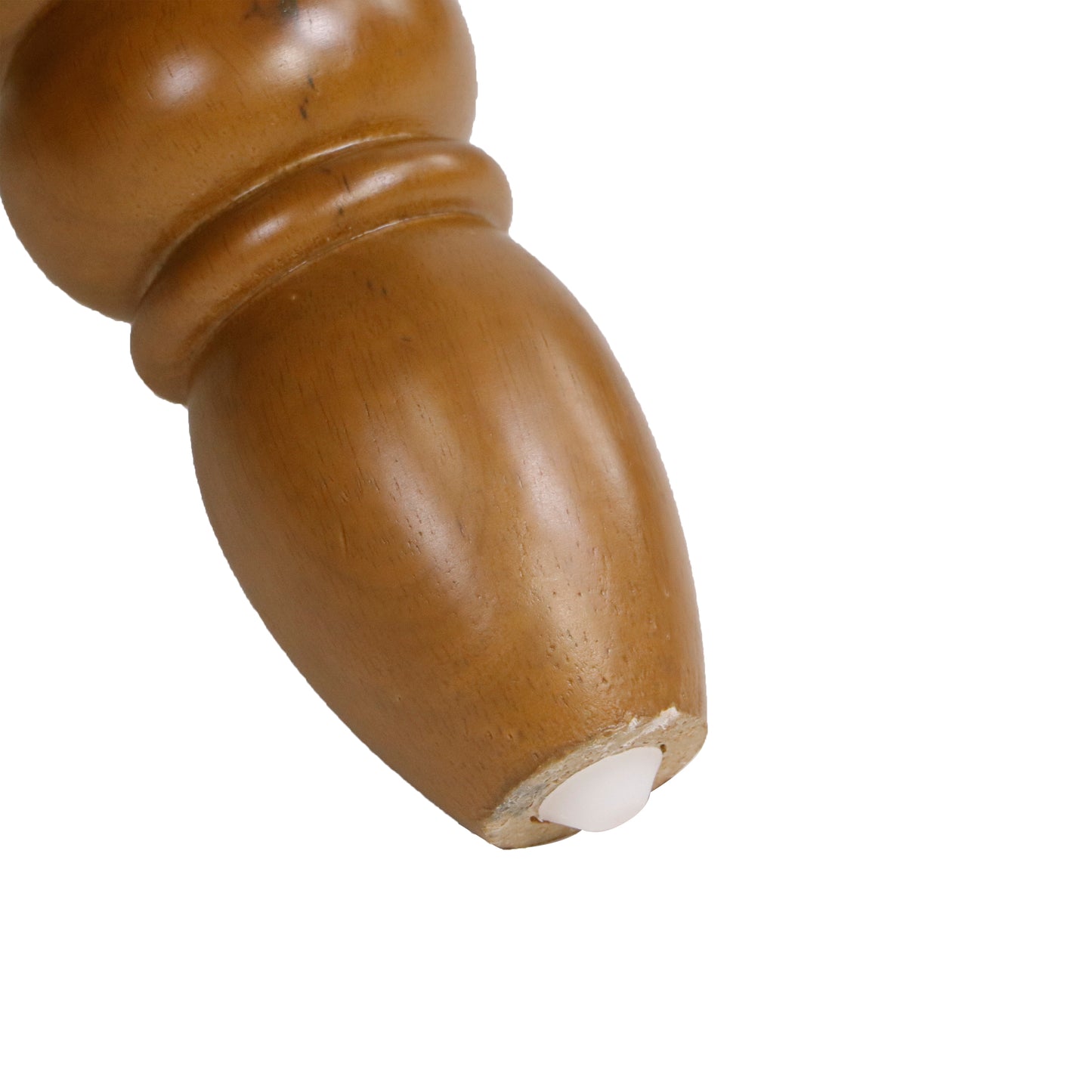 Wooden furniture leg with carved details and a white plastic foot protector