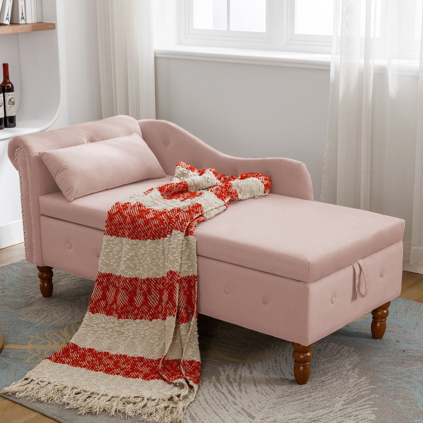Pink velvet chaise lounge with tufted back and silver nailhead trim