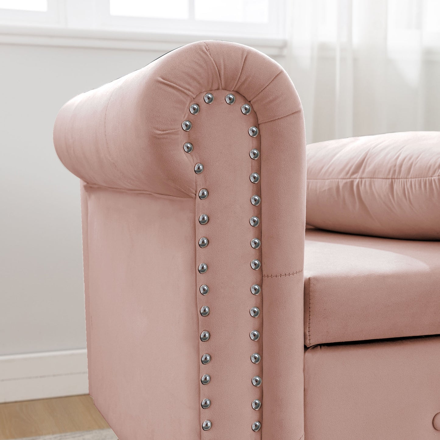 Rose velvet armchair with decorative silver nailhead trim