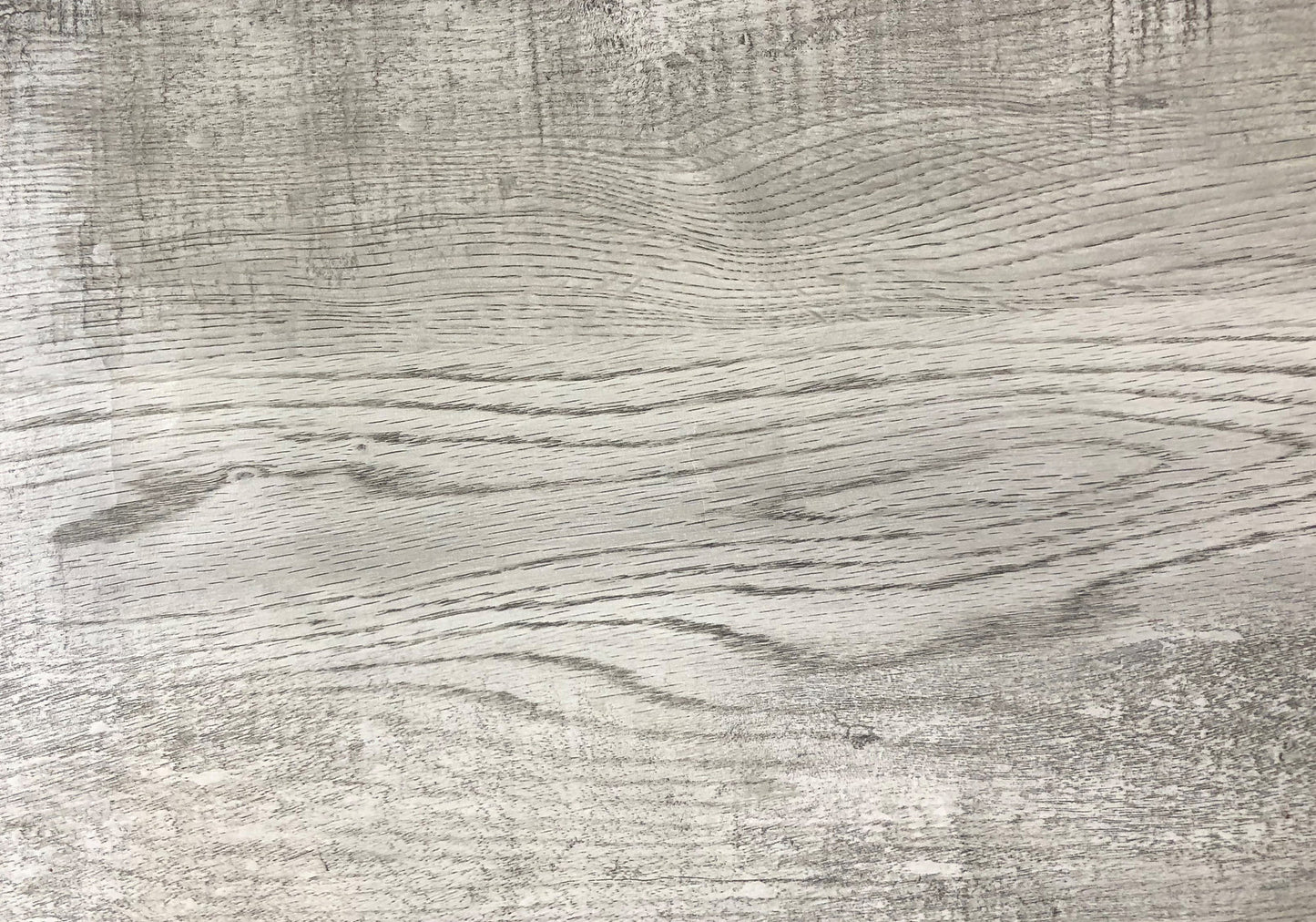 Weathered grey wood texture with distinct grain patterns